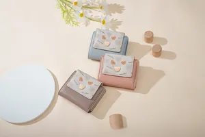 Detail view of colorful PU leather wallets featuring cute cartoon bear patterns and Daisy decor