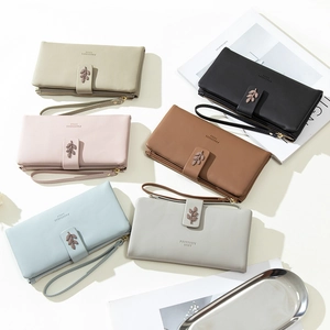 Long faux leather women's zip wallets with wrist strap and metal leaf detail in six colors