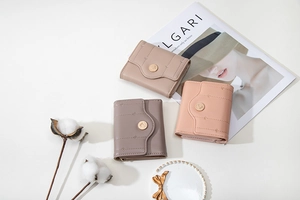 Three-fold short leather wallets in multiple colors with palm tree metal snap buttons
