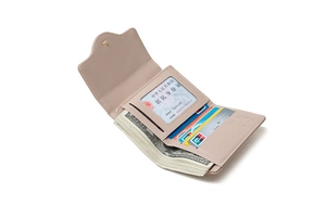 Detail view of pink trifold wallet interior showing card slots and ID window