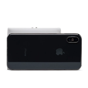 Short faux leather wallet for women with leaf buckle compared to a smartphone for size