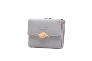 Side view detail of a light grey women's tri-fold wallet with gold leaf buckle closure
