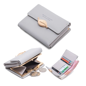 Detail view of grey tri-fold wallet with leaf clasp, coin pocket, and card slots