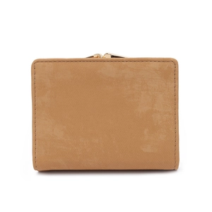 Detail of vintage matte leather texture and golden metal clasp on a trifold wallet