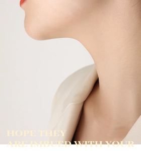 Close-up of elegant model wearing luxury U-shaped rhinestone earrings in a minimalist style