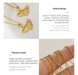 Detailed macro view of 18K gold plated ginkgo leaf pendant necklace with zircon stone