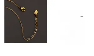 Detail of gold lobster clasp and adjustable chain with 18K engraved metal tag