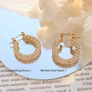 Elegant 18K gold-plated C-shaped hoop earrings with pave-set shimmering zircon stones