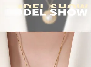 Close-up of elegant gold box chain necklace with a French vintage style aesthetic
