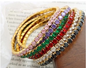 Detail of colorful tennis bracelets with 18K gold plating and sparkling zircon stones