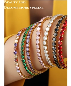 Detail of 18K gold-plated tennis bracelet featuring colorful square-cut cubic zirconia