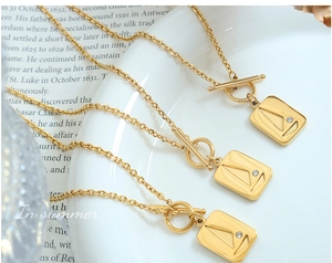 Detail of square sailing pendant necklace with zircon inlay and OT toggle clasp