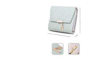 Light green quilted tri-fold wallet with leaf pendant and 11.5x9.5x3cm dimensions
