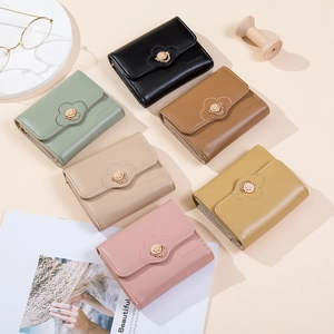 Minimalist women's trifold mini wallets with petal-shaped flap and gold floral buckle