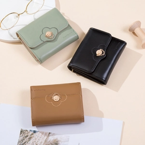 Three-fold PU leather mini wallets in sage green, black, and caramel with floral buckles