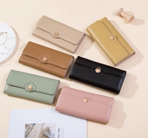 Close-up of heart-stitched PU leather long wallets with golden chain ring buckle detail