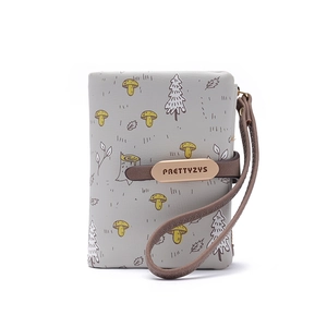 Detailed close-up of light gray PU leather wallet with autumn mushroom illustration