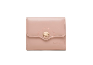 Detail of light pink tri-fold wallet featuring flower embroidery and metal buckle