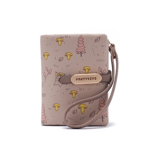 Close-up of the pastel pink PU leather coin purse with cute mushroom forest patterns