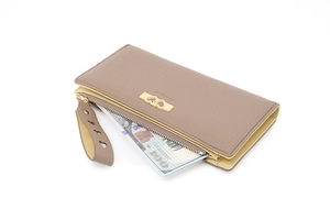 Detail of taupe litchi grain long wallet showing spacious interior and golden heart buckle