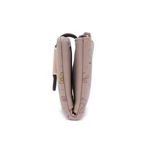 Side view detail of a slim PU leather bifold wallet with cute hand-drawn cartoon prints