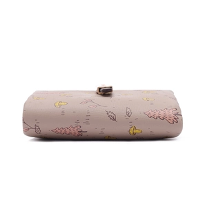Close-up of terracotta brown PU leather wallet featuring autumn mushroom and pine tree patterns