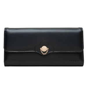 Detailed view of women's long black wallet with gold flower clasp and floral edge stitching