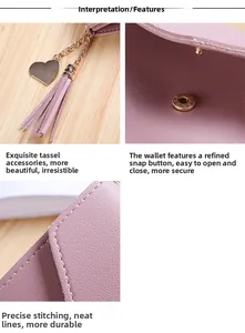 Pink leather wallet detail with metal heart tassel pendant and fine stitching work