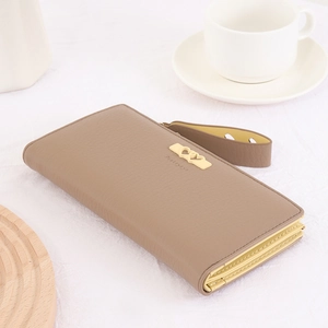 Detail of mocha brown litchi grain leather wallet with golden heart metal buckle