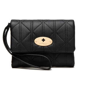 Detail of black quilted faux leather wallet featuring a gold oval twist-lock and wrist strap