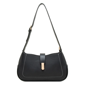 Detail of black faux leather crescent bag showing white stitching and gold hardware