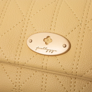 Women's yellow quilted PU leather wallet with elegant gold floral twist lock closure