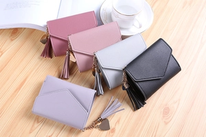 Short PU leather envelope wallets in five colors featuring heart charms and tassels