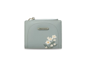 Dettaglio del portafoglio in pelle PU blu-verde con stampa floreale e zip dorata