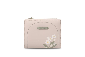 Dettaglio portafoglio in pelle PU rosa con stampa floreale e zip dorata lucida