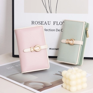 Minimalist medium-long women's wallet in pink and green with a bow metal buckle