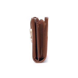 Side view of brown leather wallet showing multi-layered storage and gold heart detail