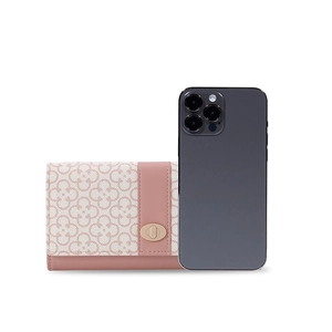 Detailed comparison of long pink crochet wallet next to a smartphone for size reference