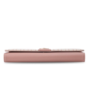 Detail shot of the long pink PU leather wallet showing stitching and material textures