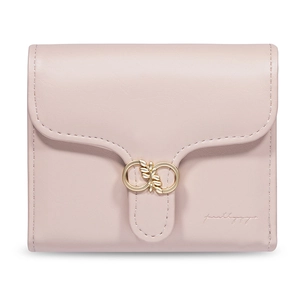 Close-up of pink leather wallet featuring a golden ring metal buckle and matte texture