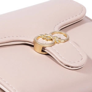 Pale pink leather tri-fold wallet for women featuring a gold interlocking round buckle
