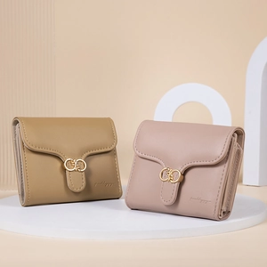 Close-up of trifold PU leather wallets with elegant metal buckles and precise stitching