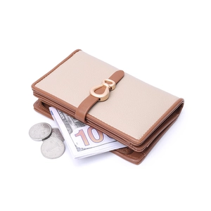 Beige and brown leather bifold wallet for women featuring a gold buckle and coin pocket