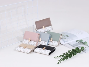 Detailed collection of floral patchwork mini wallets with golden leaf buckle decoration