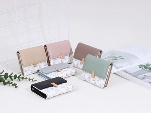 Collection of minimalist tri-fold short wallets for women with floral print and gold clasp