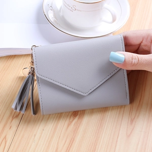 Short grey envelope wallet with litchi texture leather and heart tassel pendant
