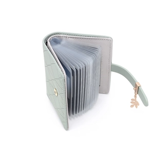 Mint green RFID blocking card holder wallet with leaf pendant and multi-card slots