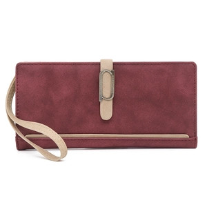 Close-up of wine red frosted long wallet with vintage bronze buckle and wristlet strap