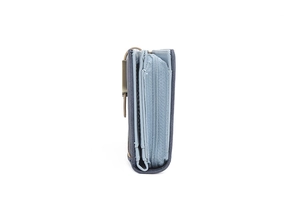 Detail view of multi-layer storage and blue nylon zipper closure on minimalist wallet