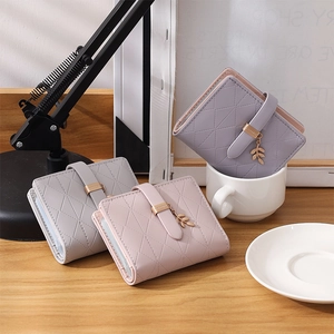 Short RFID bifold wallets in Morandi colors featuring quilted faux leather and leaf charms